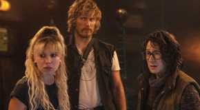 Millie Bobby Brown as Michelle, Chris Pratt as Keats, and Ke Huy Quan as Dr. Amherst staring off together in The Electric State