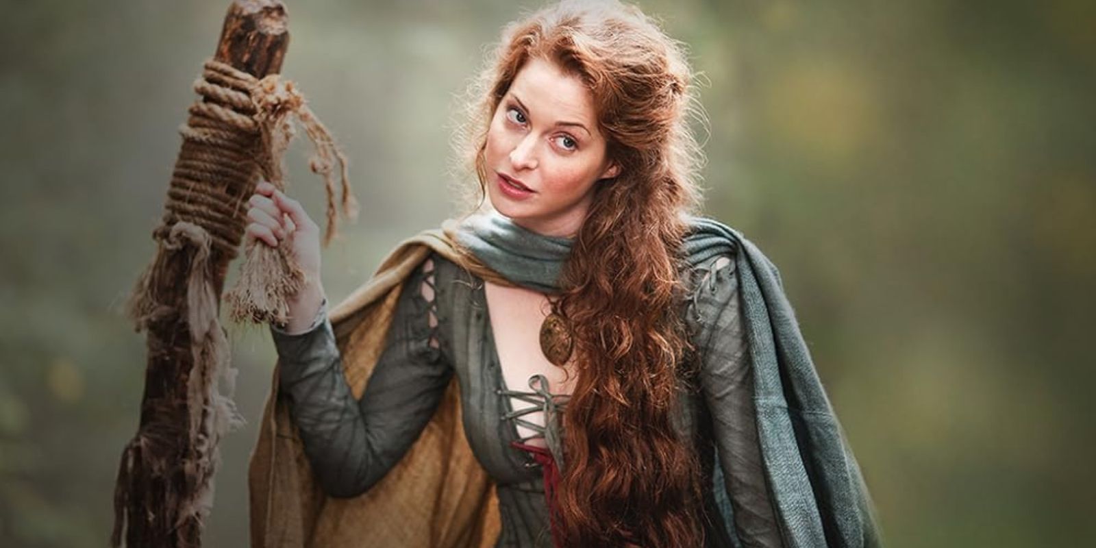 Ros looking sassy while sitting on the back of a wagon in Game of Thrones