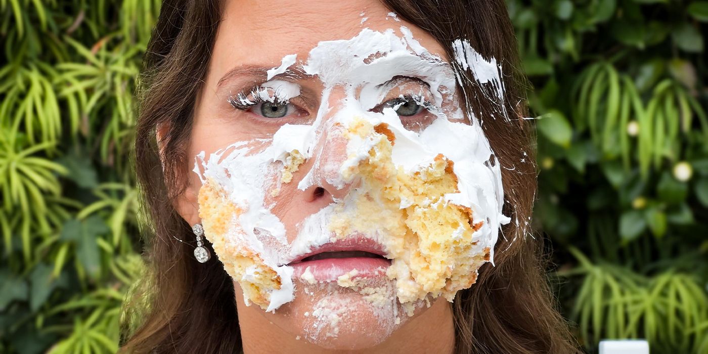 Close-up of Amy Landecker with cake on her face in For Worse