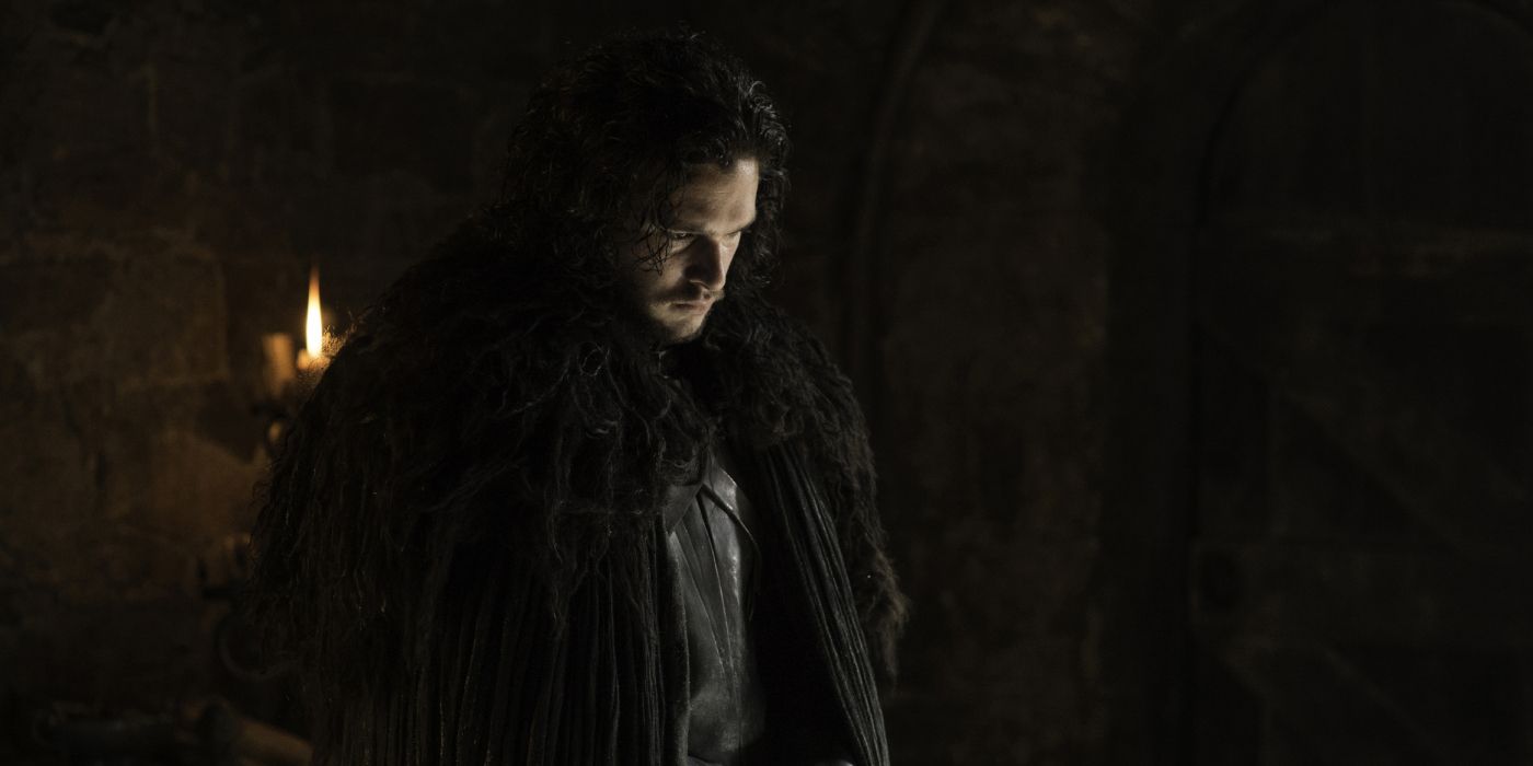Jon Snow looking down at something in Game of Thrones