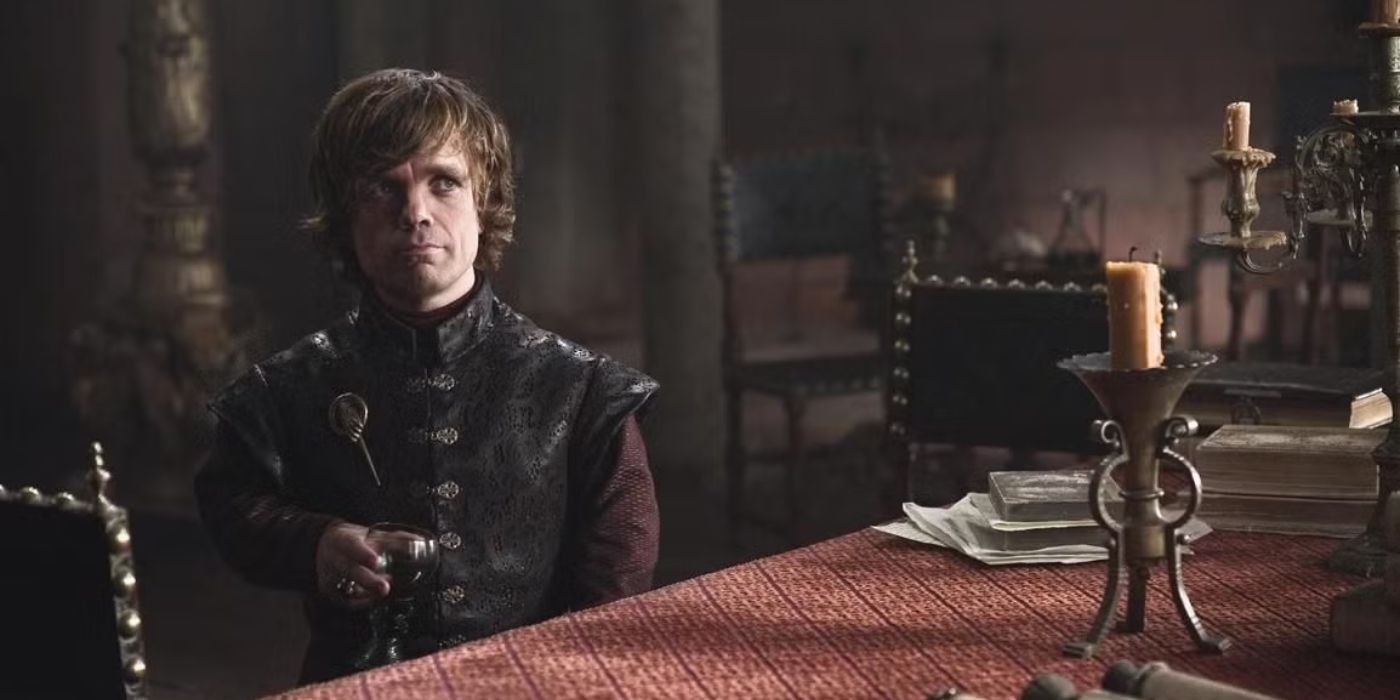 Tyrion Lannister smirking while holding a goblet of wine in Game of Thrones
