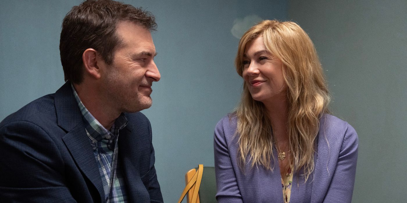 Ellen Pompeo and Mark Duplass smile in an interview room in Good American Family.