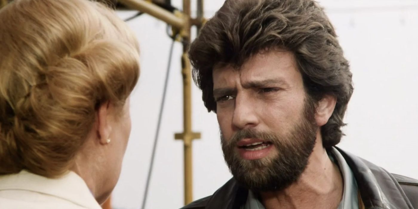 Steve Inwood as Nick Hollister and Louise Fletcher as Eileene Draygon talking to each other in closeup in Grizzly II: The Revenge