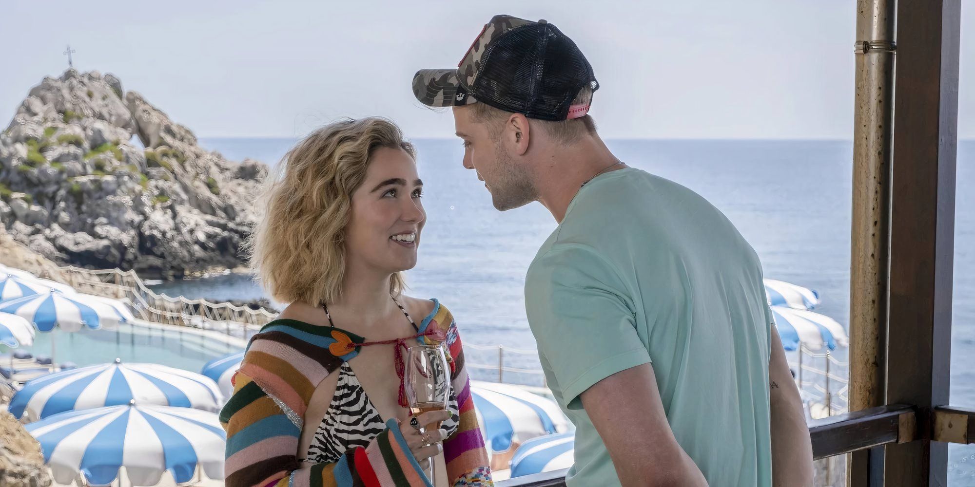 Haley Lu Richardson as Portia in The White Lotus looking at Leo Woodall as Jack.
