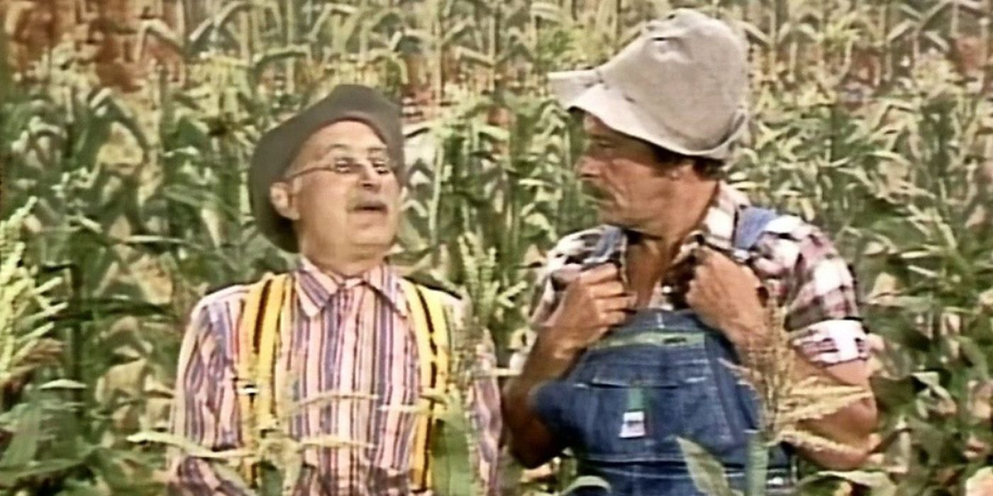 Two men dressed as farmers in a corn field in Hee Haw.
