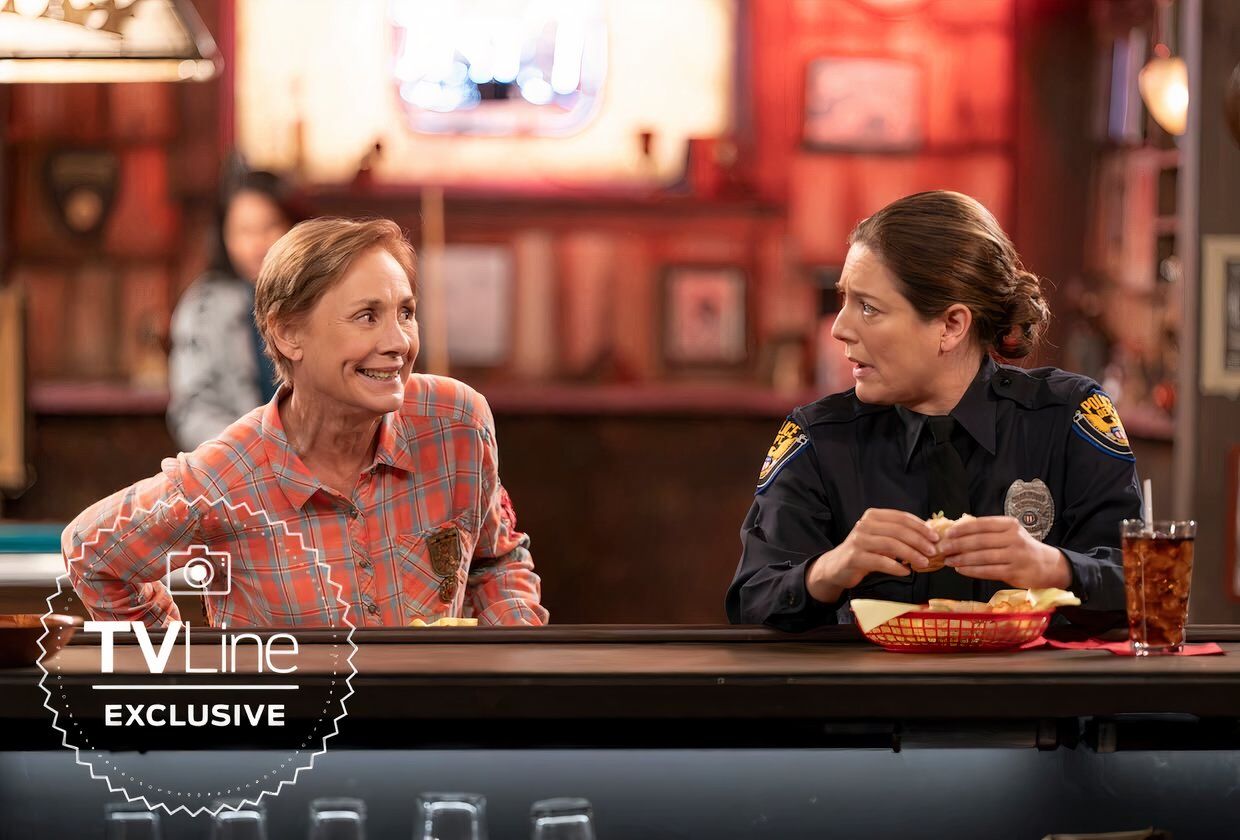 Laurie Metcalf is beaming at Zoe Perry in a restaurant in The Conners