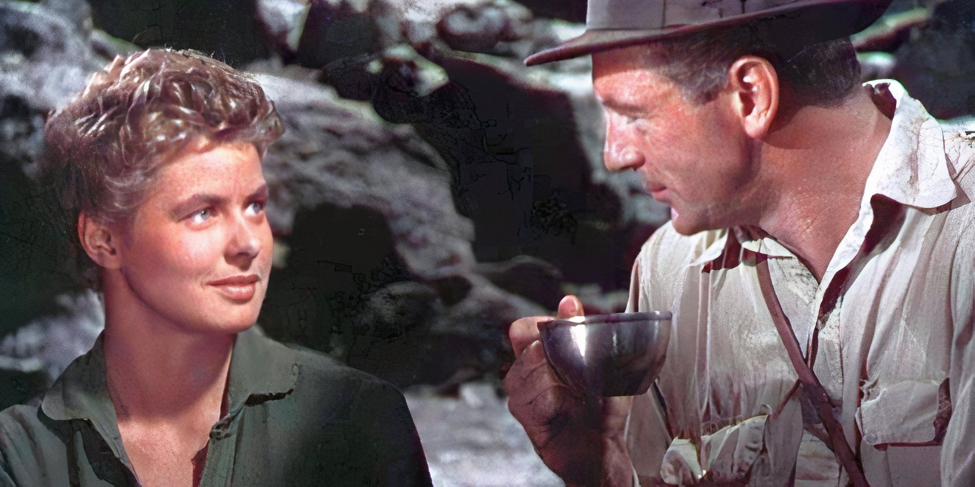 Ingrid Bergman looking at Gary Cooper sitting next to her in For Whom the Bell Tolls (1943).
