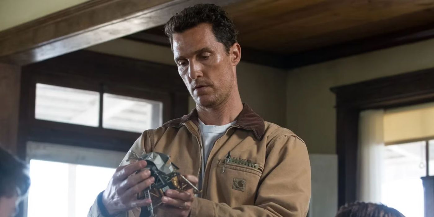 Matthew McConaughey as Joseph Cooper inspecting a spaceship part in Interstellar