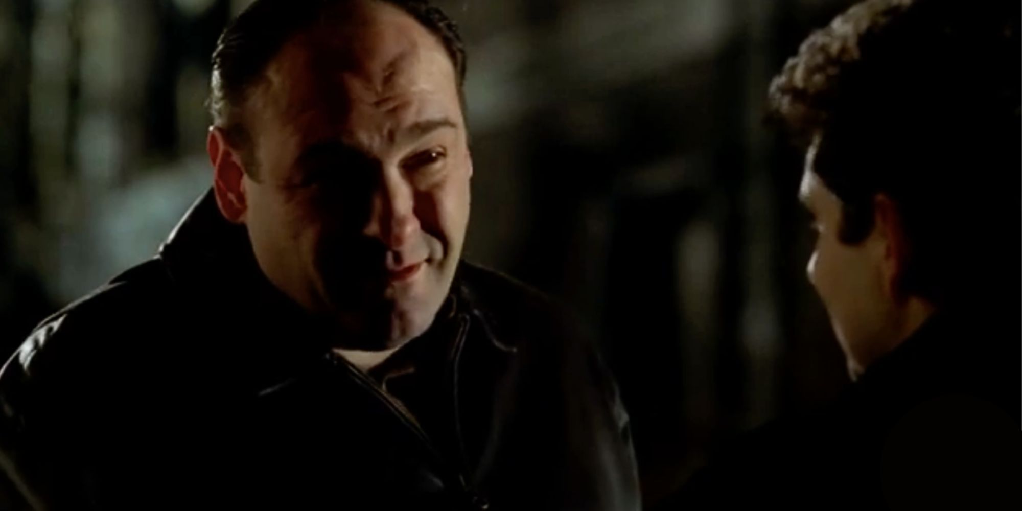 James Gandolfini standing in front of Michael Imperioli who has his back to the camera in The Sopranos S4, E6