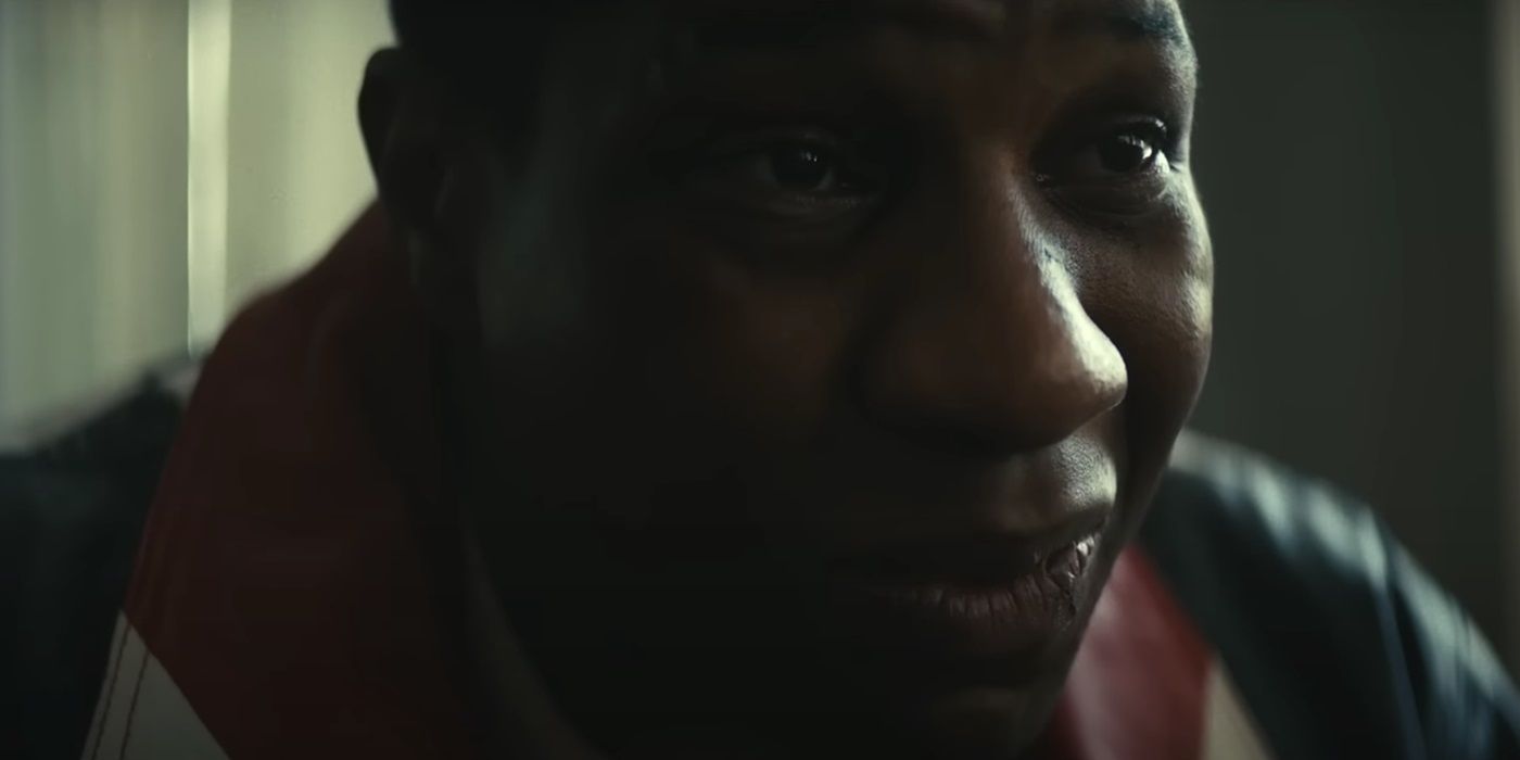 Jonathan Majors, smiling, in Magazine Dreams