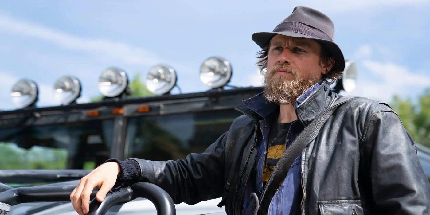 Charlie Hunnam as Charlie Waldo looking out over his vehicle in Last Looks