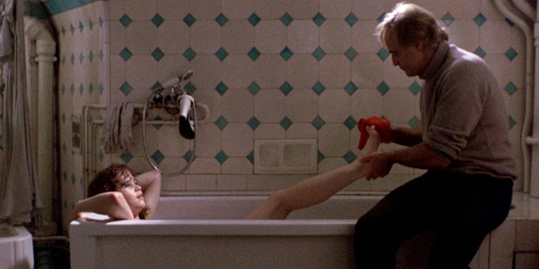 Marlon Brando bathes Maria Schneider in Last Tango in Paris