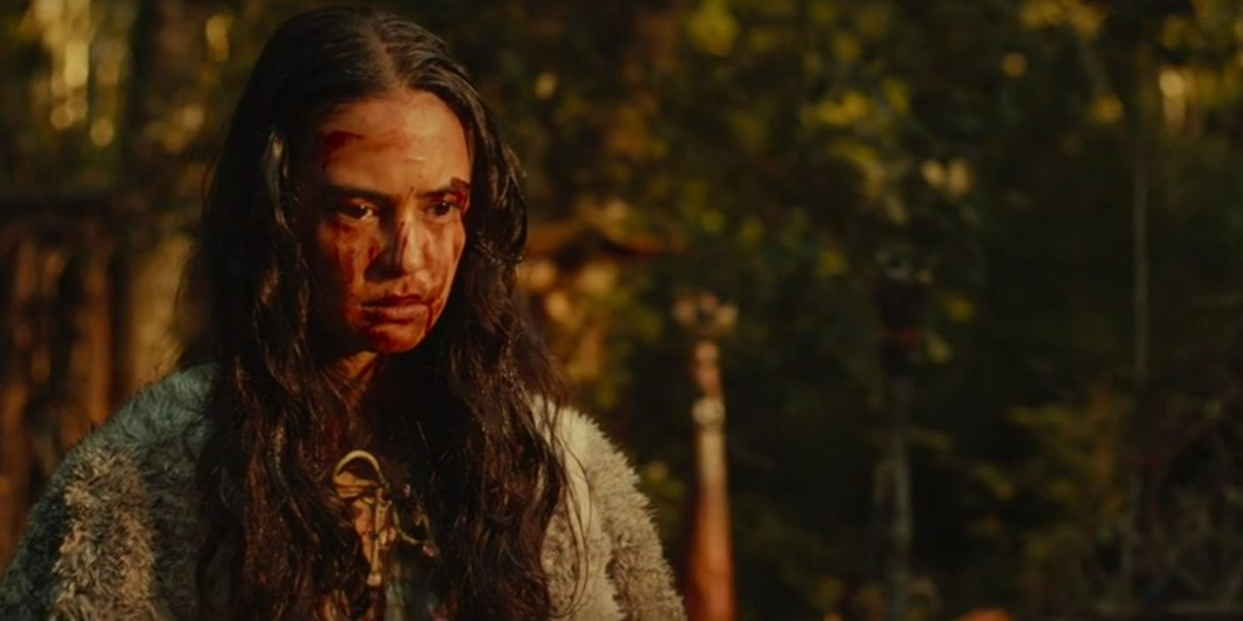 Lottie stands staring with her face smeared with bloody fingerprints on Yellowjackets