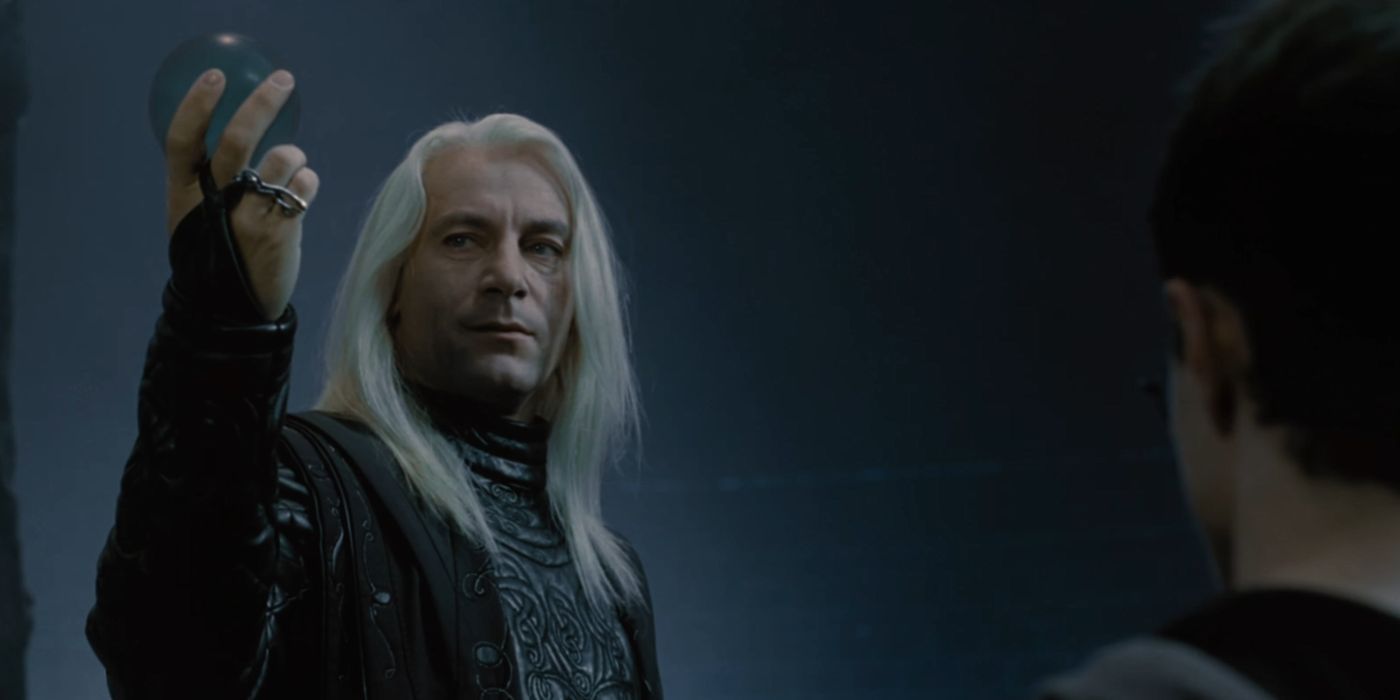 Lucius Malfoy holding an orb in front of Harry in Harry Potter and the Order of the Phoenix.