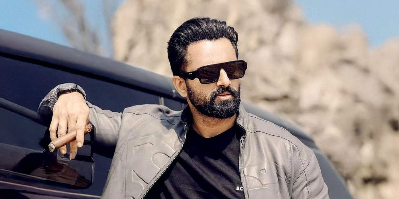 Unni Mukundan as Marco in the 2024 film Marco holding a cigar