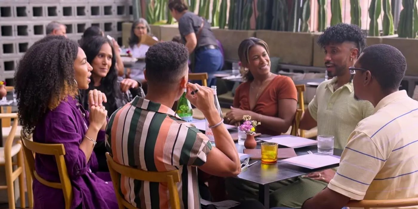 Ramses meets Marissa's family as they sit at a long table on the patio of a restaurant on Love is Blind.