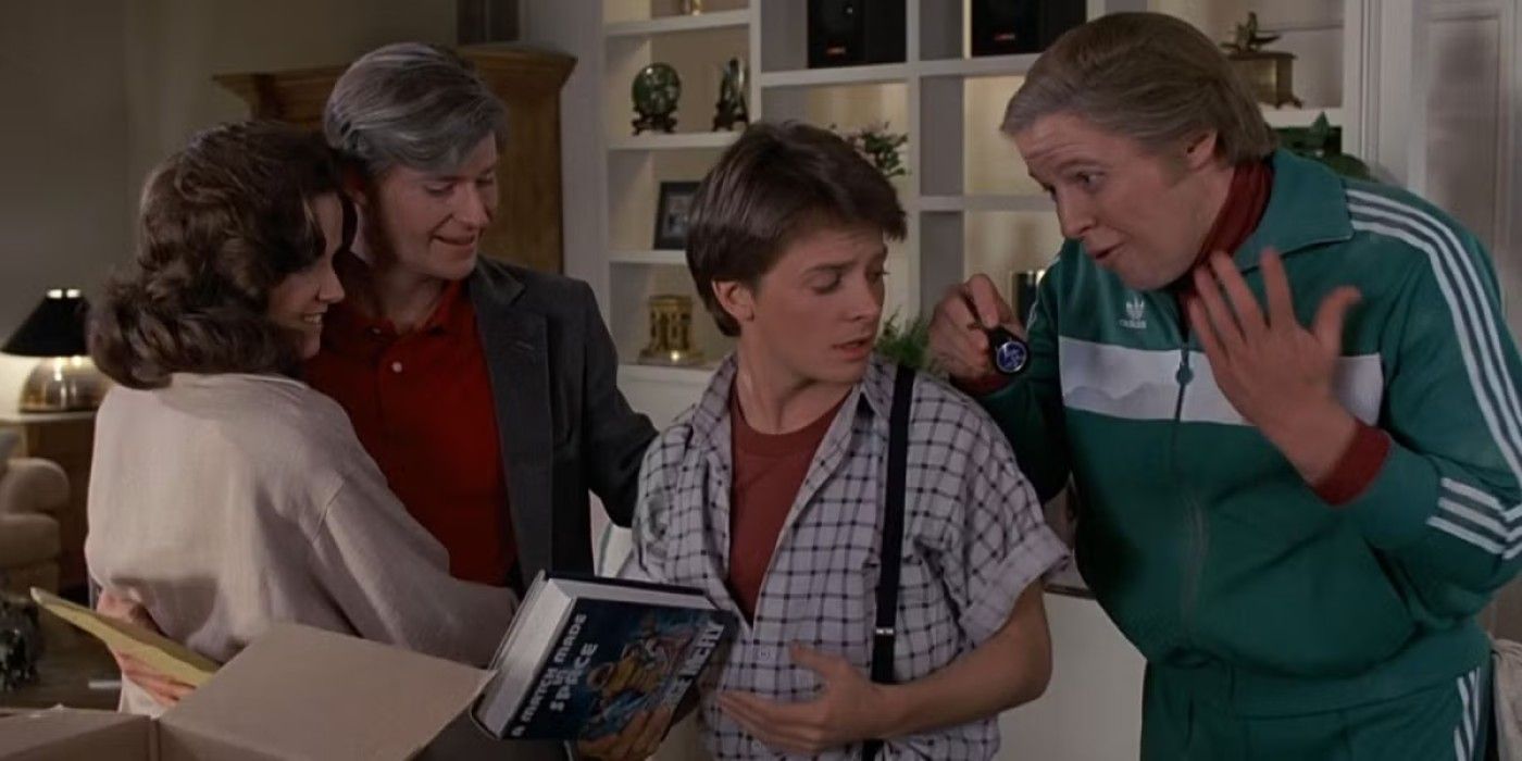 The McFlys (Lea Thompson and Crispin) Glover hugging, Marty (Michael J. Fox), and Biff (Thomas F. Wilson) at the end of &lsquo;Back to the Future&rsquo;