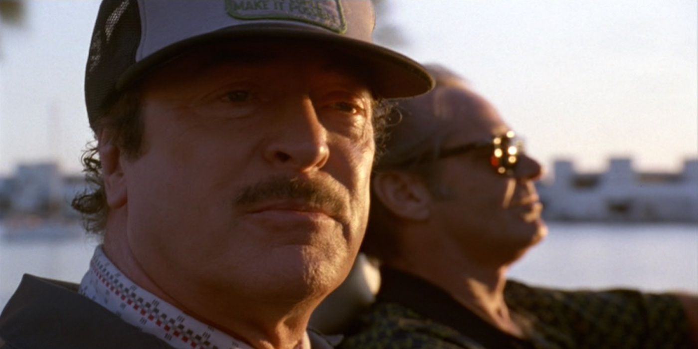 Michael Caine as Victor looking away in passenger seat next to Jack Nicholson as Alex in Blood and Wine.