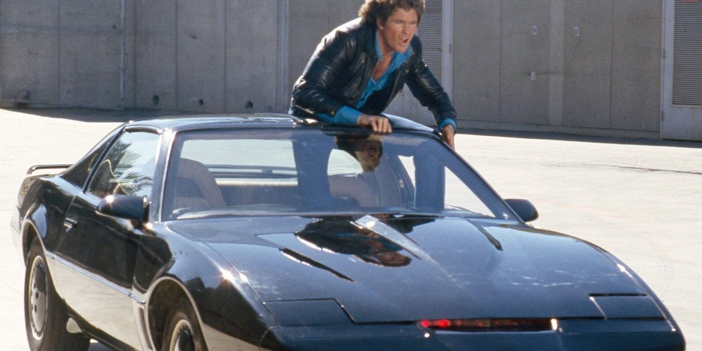 Michael Knight (David Hasselhoff) stands up out of KITT's (the car) sunroof in Knight Rider.