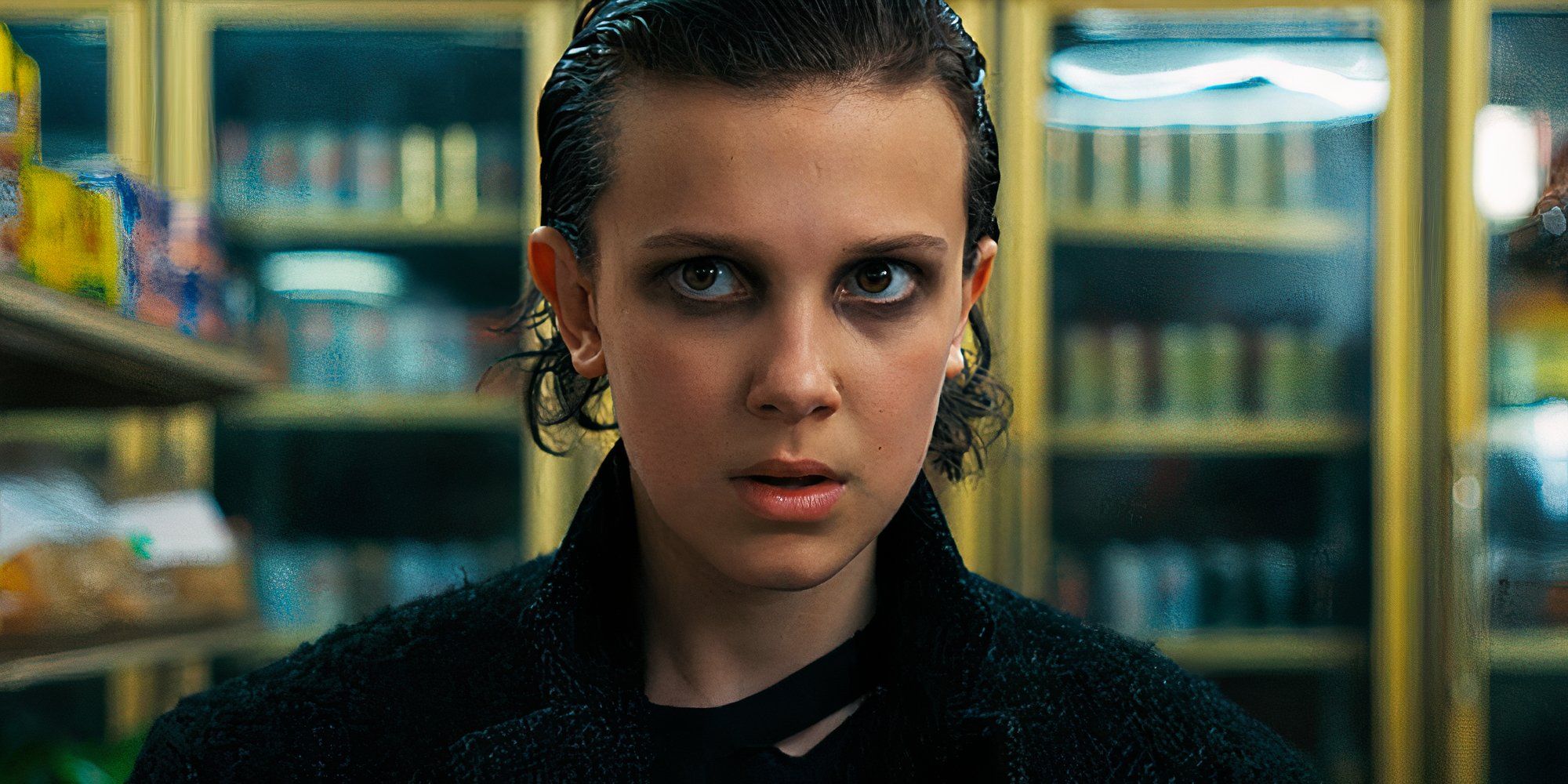 Millie Bobby Brown as Eleven in Stranger Things wearing dark eye shadow.