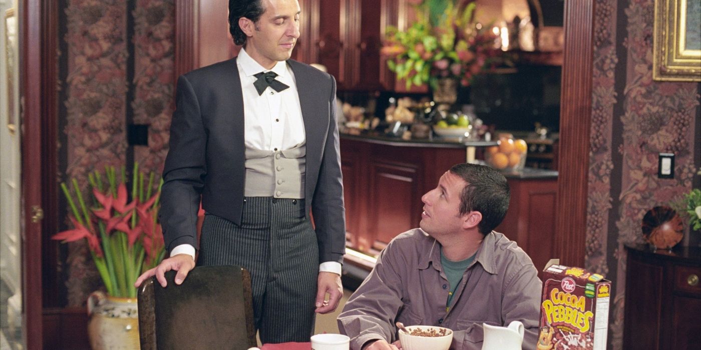 John Turturro&rsquo;s Emilio standing next to Adam Sandler&rsquo;s Longfellow in Mr. Deeds