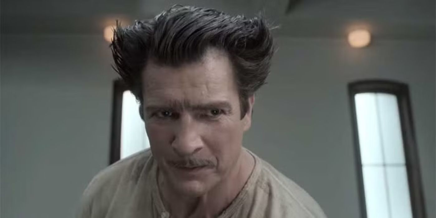 Nathan Fillion as Jacques Snicket with stylized hair and a mustache in A Series Of Unfortunate Events.