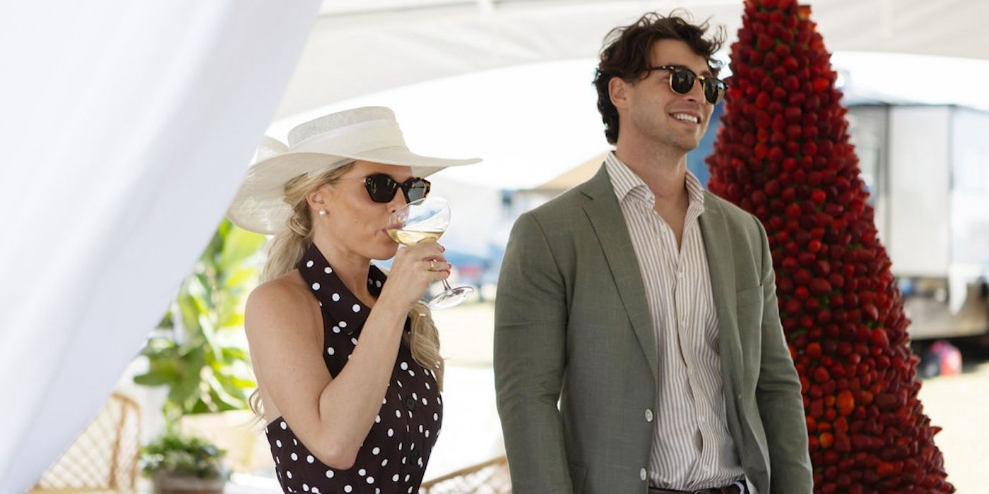 Madison LeCroy stands next to her husband Brett and drinks a beverage on Southern Charm.