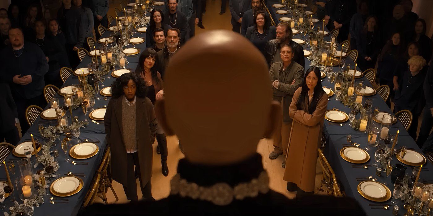 John Malkovich as Alfred Moretti staring at the cast of Opus in a vast dining hall, including Murray Bartlett as Stan, Ayo Edebiri as Ariel Ecton and Juliette Lewis as Clara Armstrong