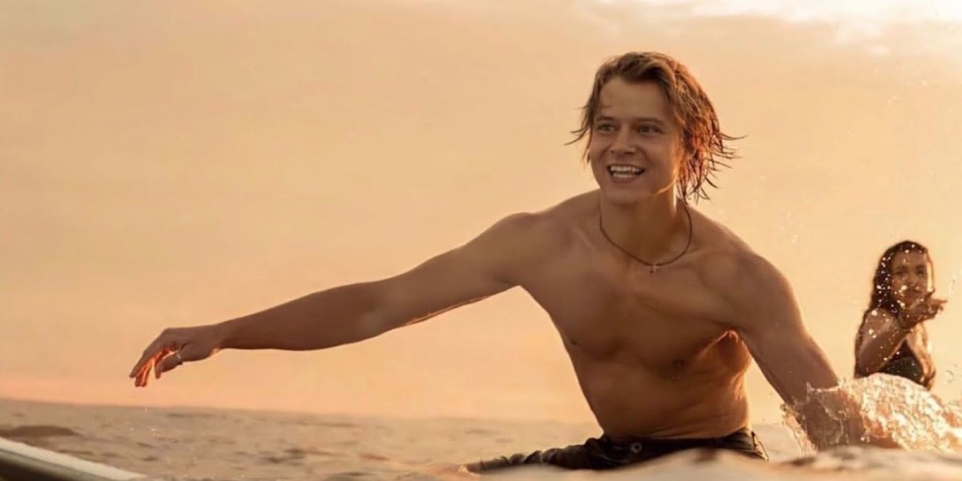 Rudy Pankow as JJ on a surfboard in the water in Outer Banks.