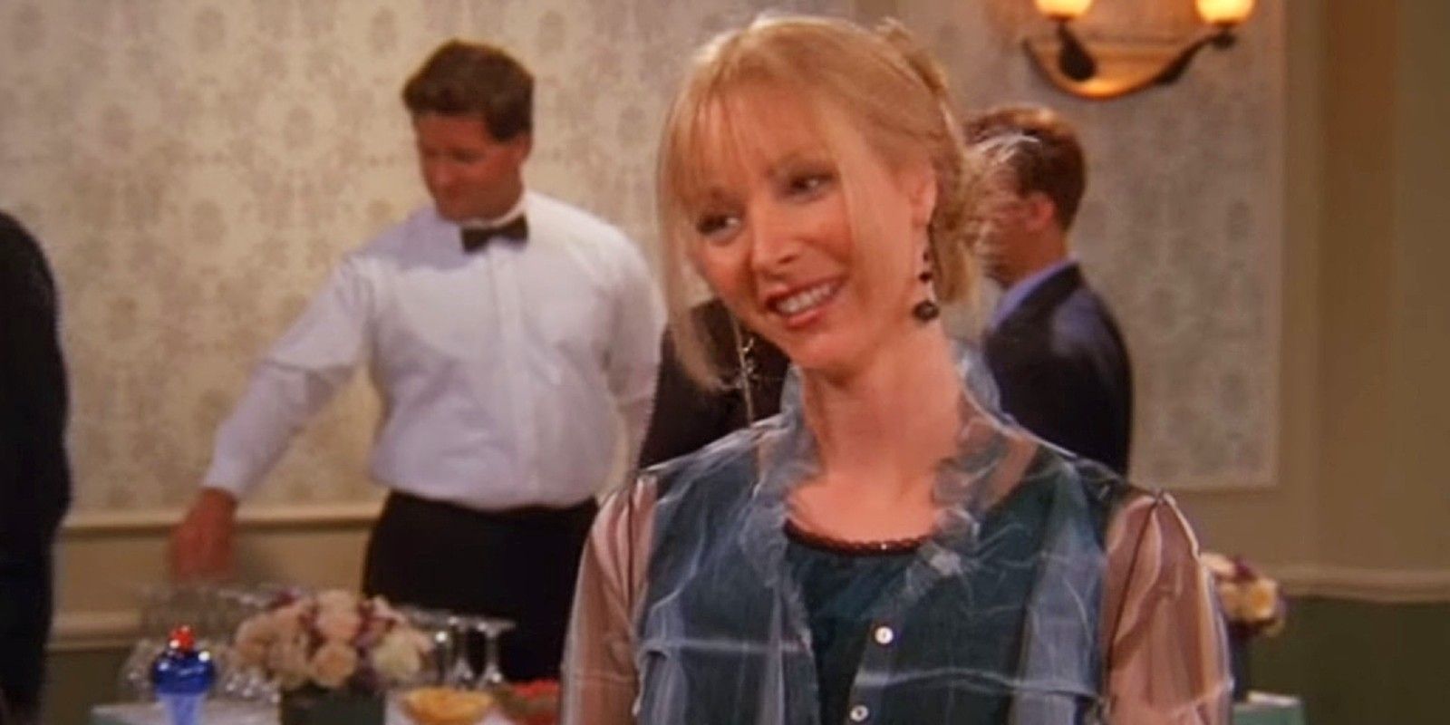Phoebe Buffay smiling at a fancy auction in Friends Season 6