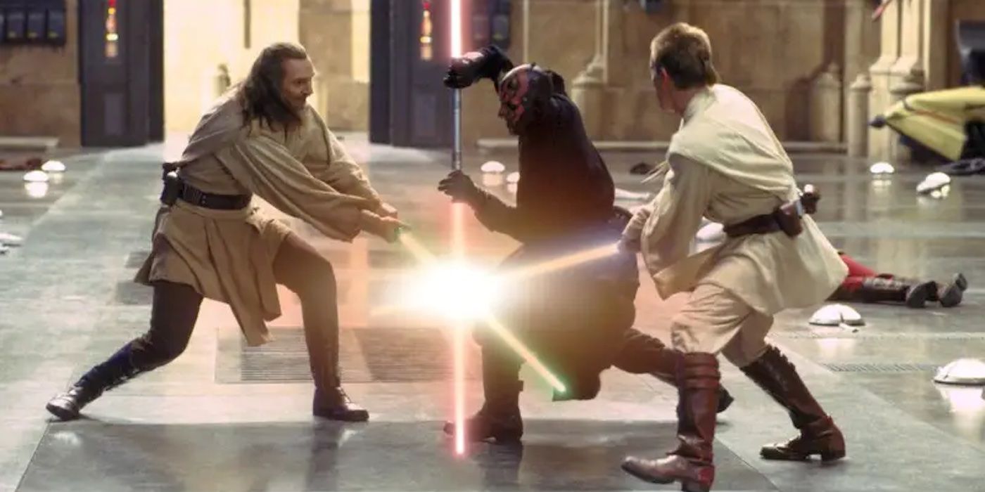 Qui-Gon Jinn (Liam Neeson) and Obi-Wan Kenobi (Ewan McGregor) are in a lightsaber battle with Darth Maul (Ray Park) in Star Wars: Episode I - The Phantom Menace.