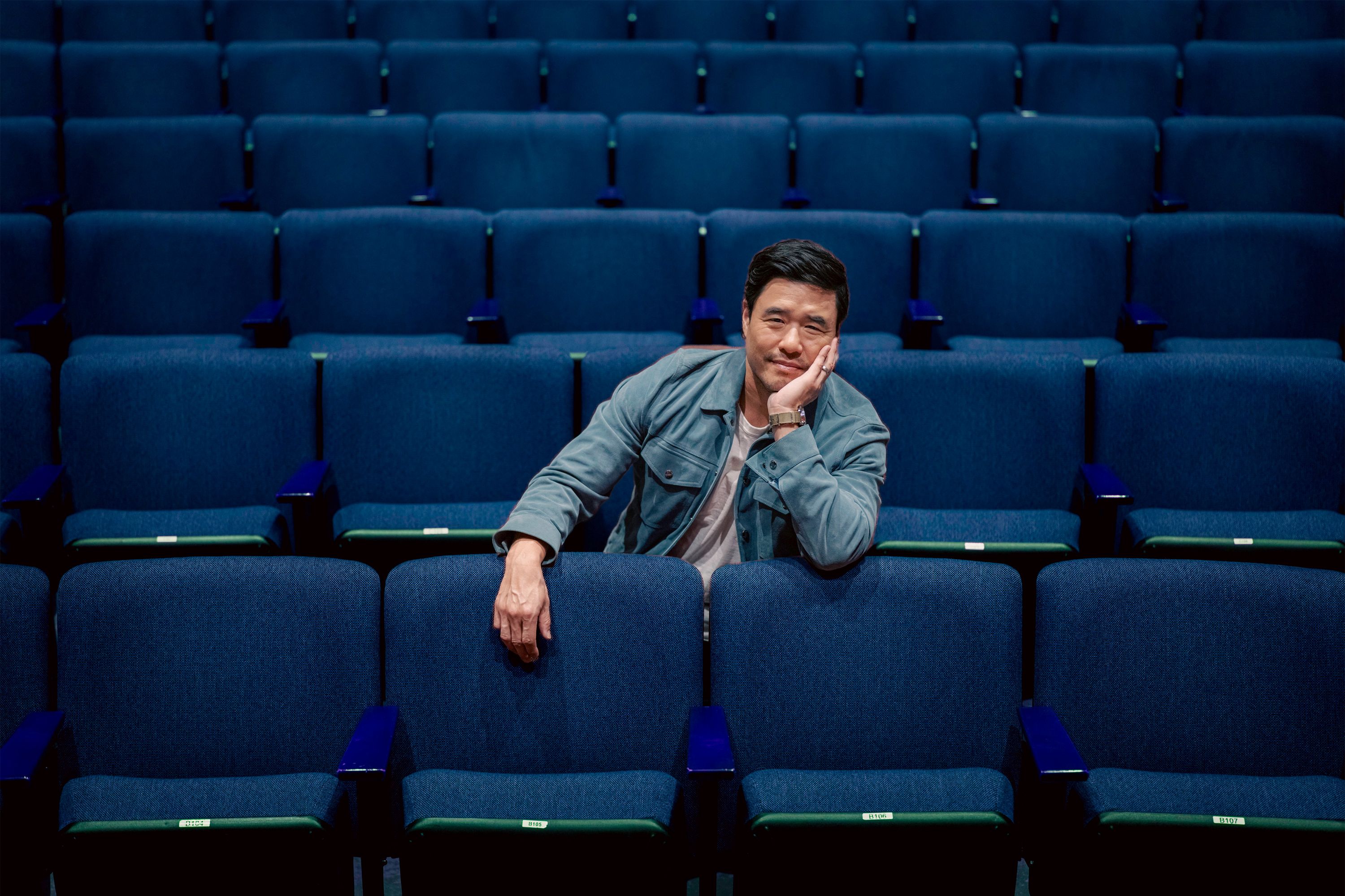 Randall Park sits in a row of seats at UCLA