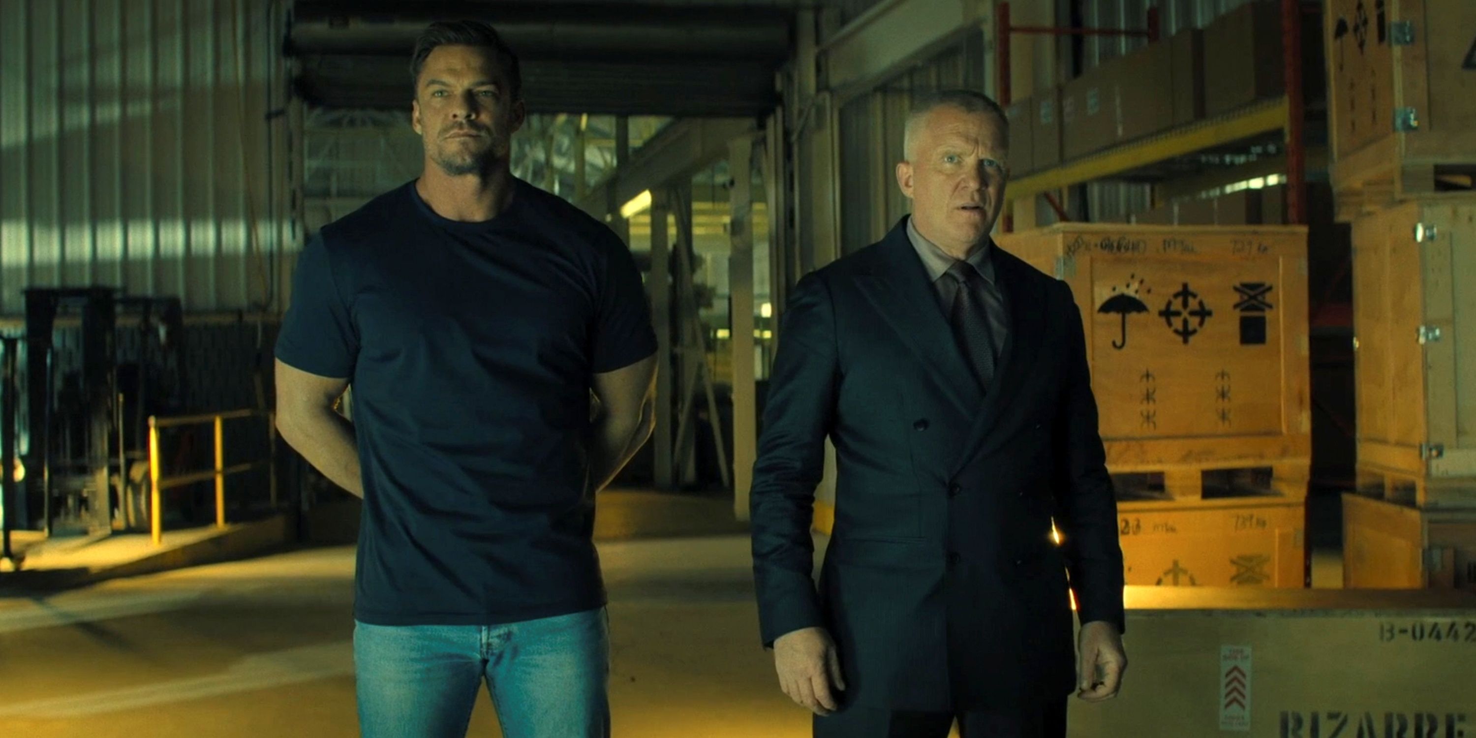 Alan Ritchson as Jack Reacher walking next to Anthony Michael Hall as Zachary Beck in Season 3 of Reacher.