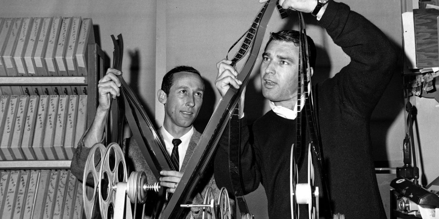 Ron Miller and Roy E. Disney look at film strips.