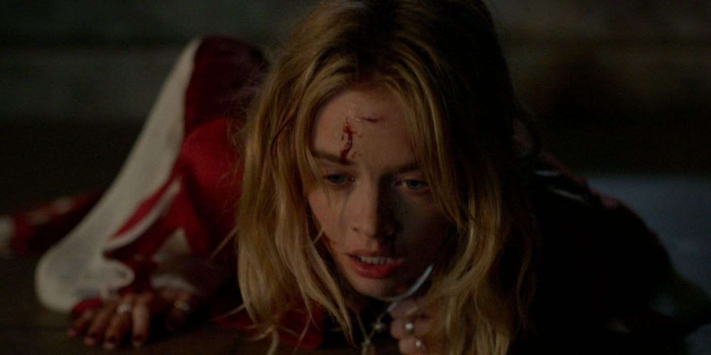 Samara Weaving laying on the floor covered in blood in 'Borderline'.