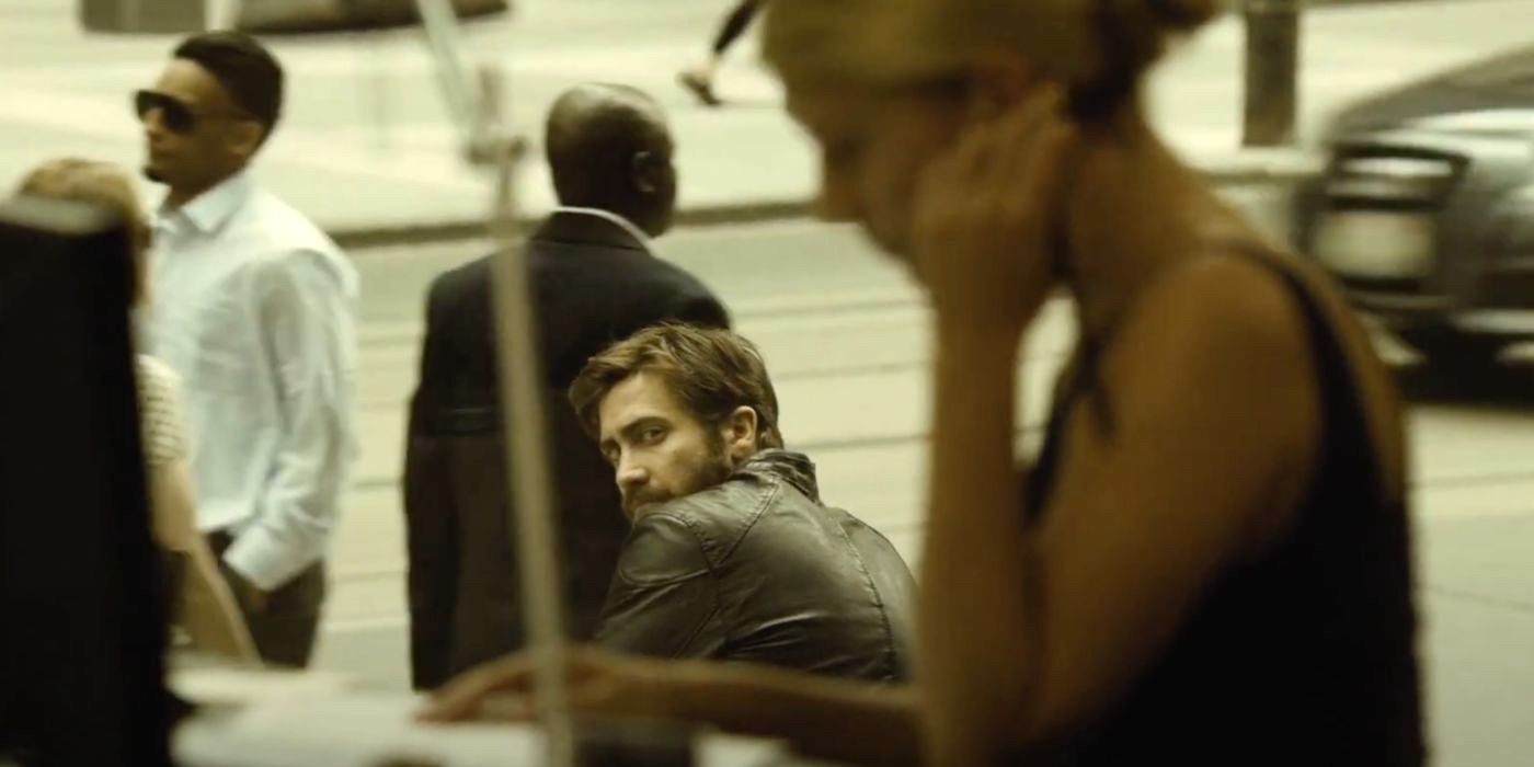 Anthony (Jake Gyllenhaal) stares ominously at the girlfriend of his double in the thriller Enemy.