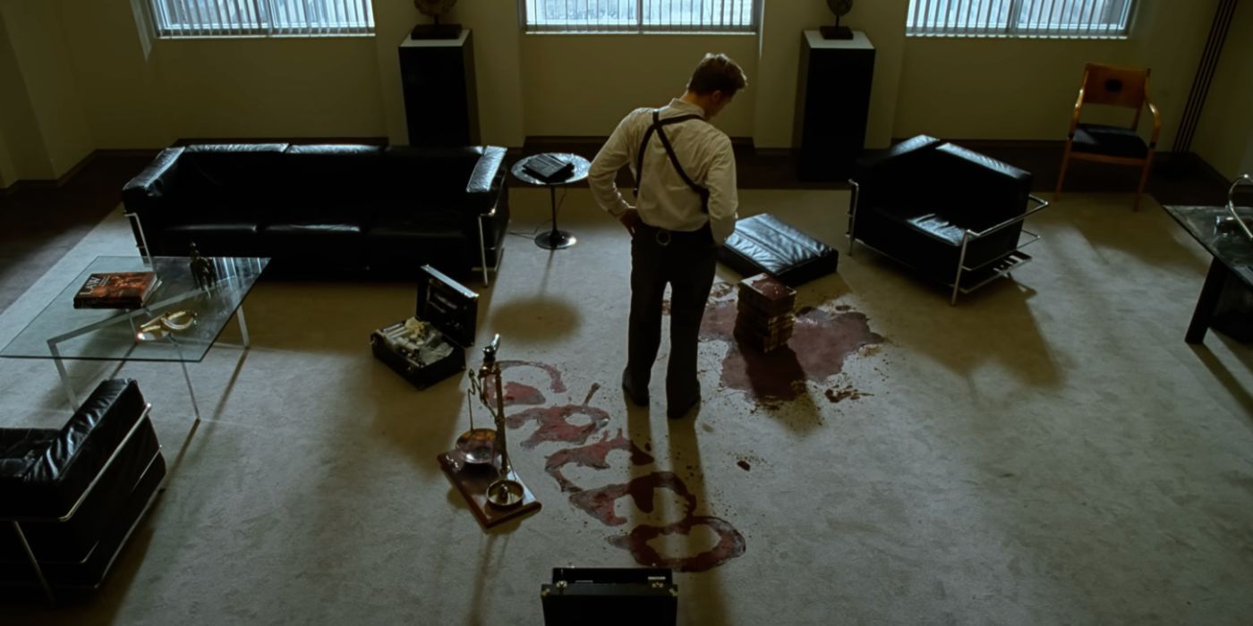Detective Mills (Brad Pitt) looks at the "greed" crime scene in the thriller Se7en.