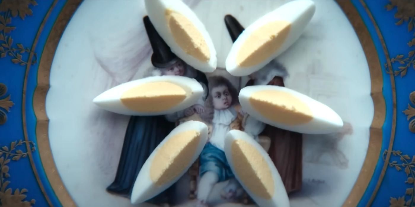 Slices of a hard-boiled egg are arranged on a plate during a weird breakfast scene in Severance Season 2.