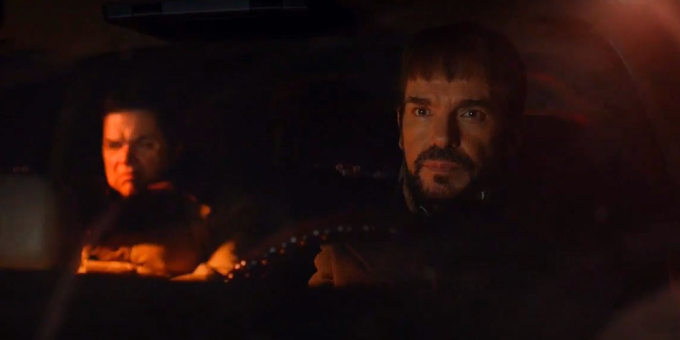 Billy Bob Thornton as Lorne Malvo drives a car at night with Oliver Pratt as Stavros seated in the backseat.