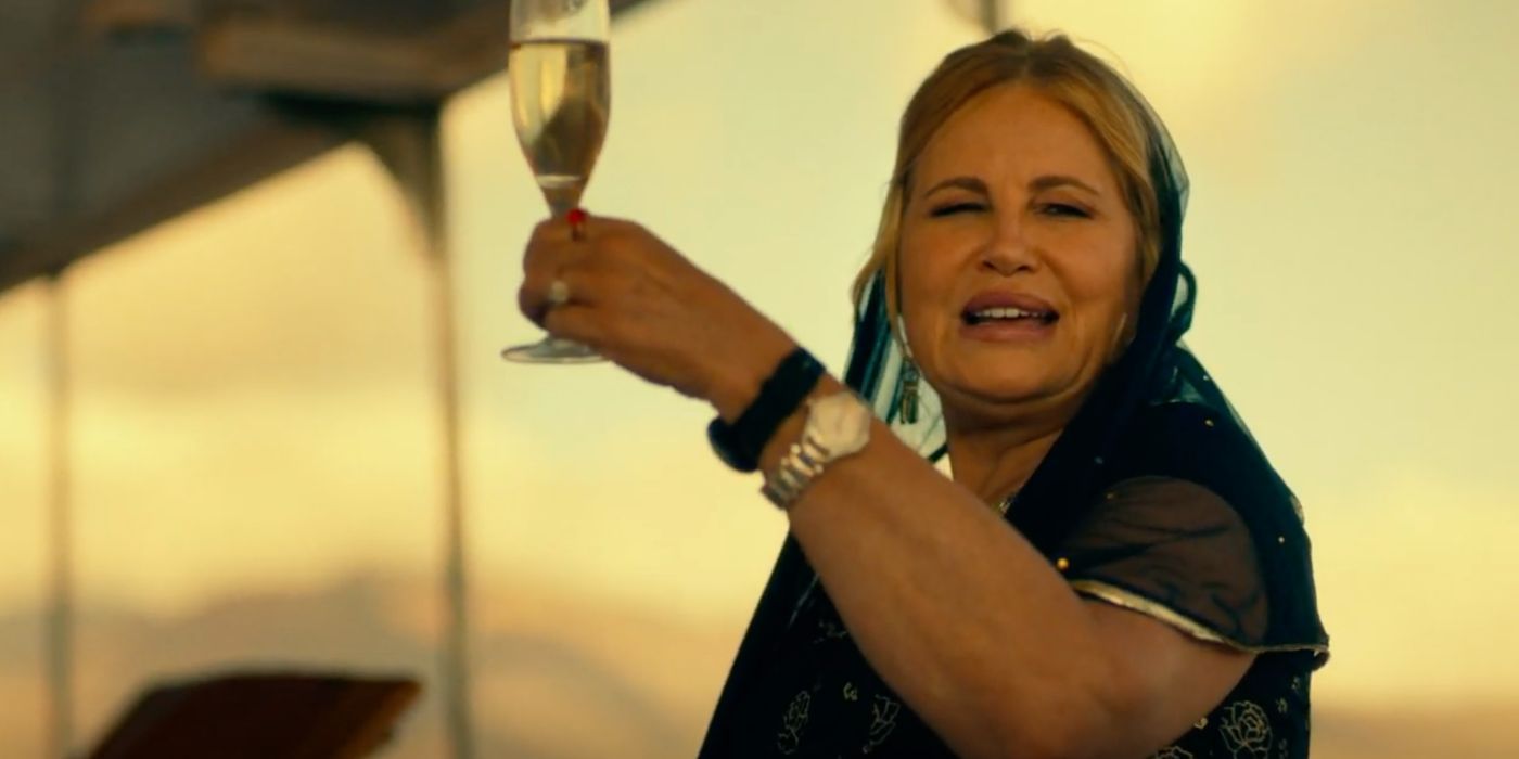 Tanya (Jennifer Coolidge) raises her wine glass in Season 1 of The White Lotus.