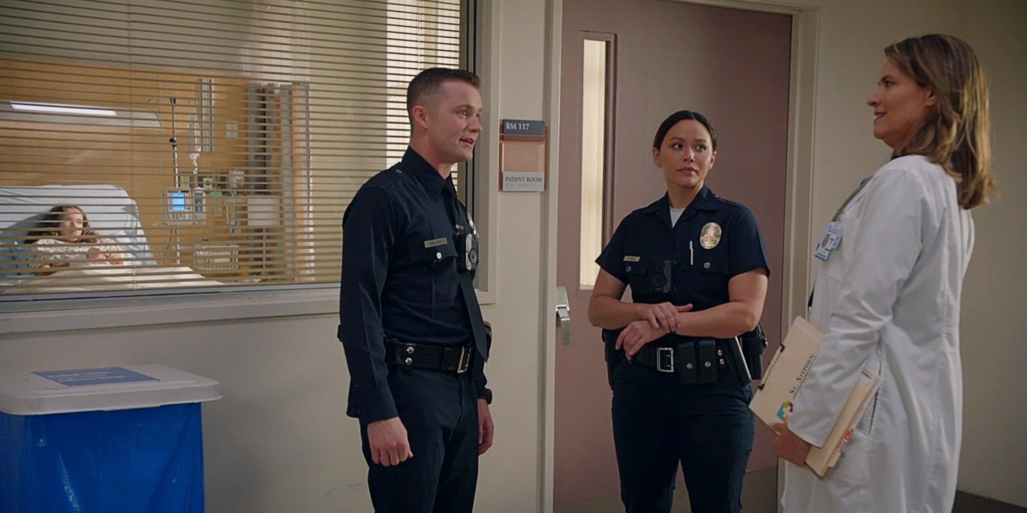 Seth Ridley and Lucy Chen talking to Seth&rsquo;s former oncologist in The Rookie