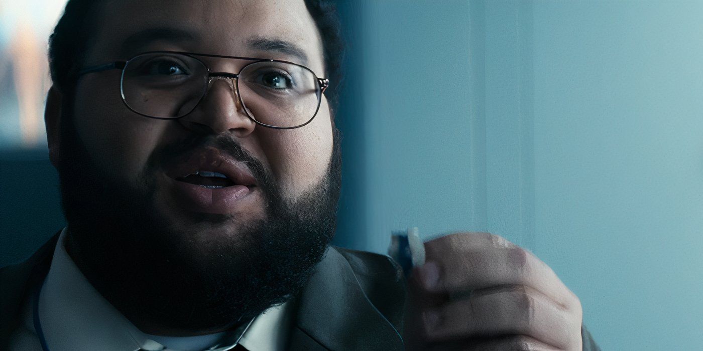 Dylan G. (Zach Cherry) proposes to Gretchen G. (Merritt Wever) with a paper engagement ring in Severance on Apple TV+.