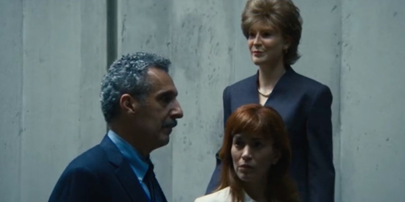 Irving and Helly talk in front a wax statue of Leonora Eagan in Severance