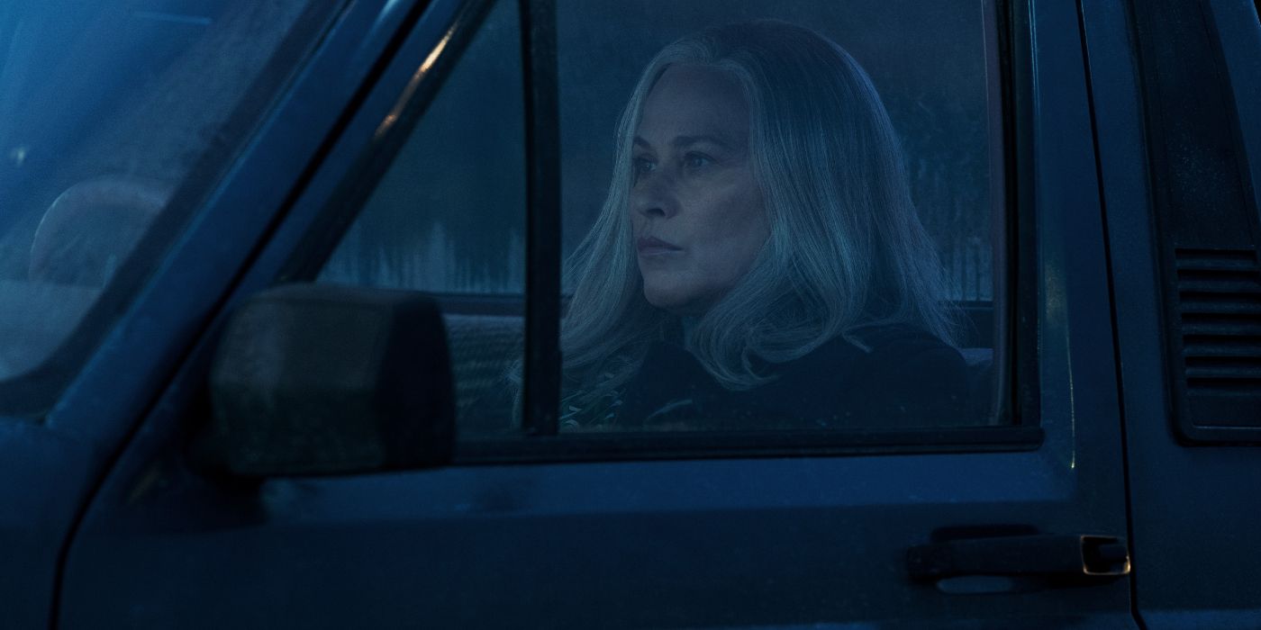 Patricia Arquette sitting in a truck