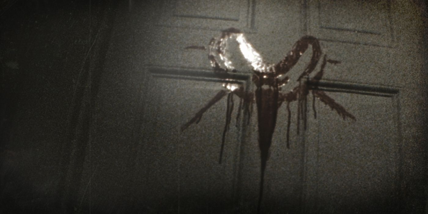 A blood symbol on a door in Sinister