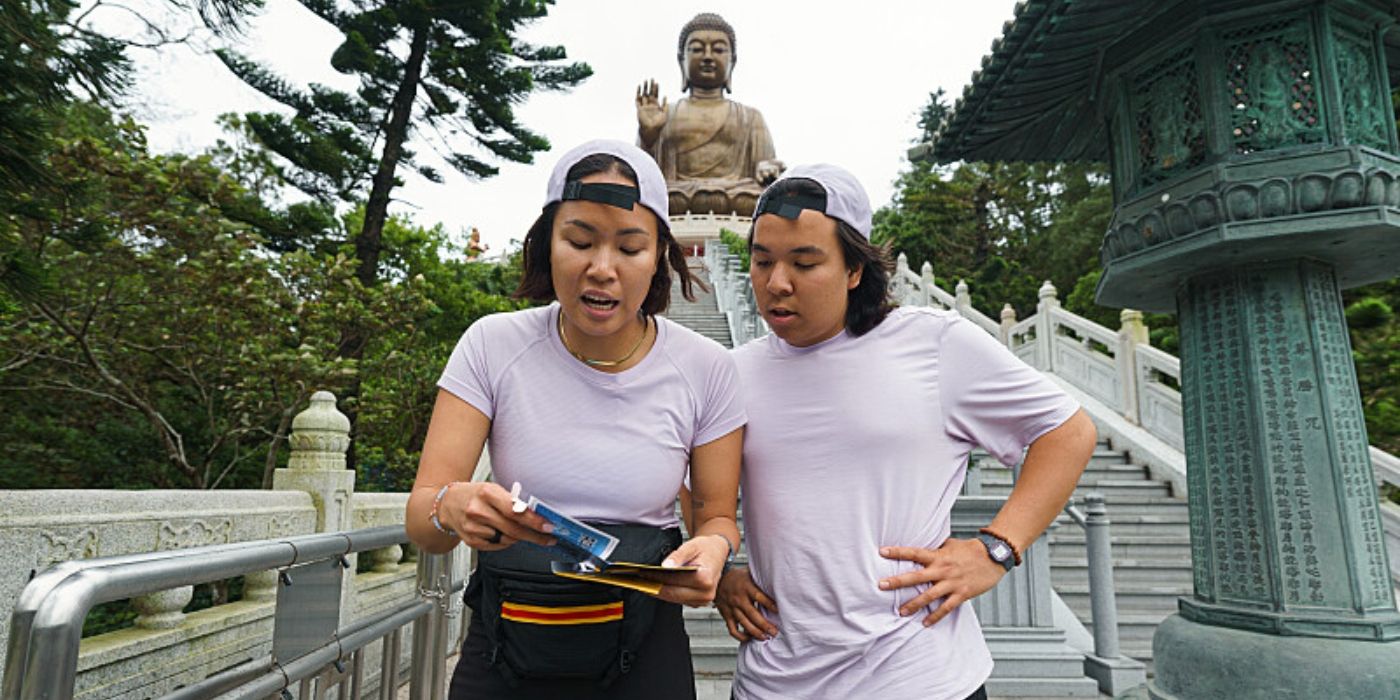 Han and Holden read their clue in Hong Kong on 'The Amazing Race' Season 37.