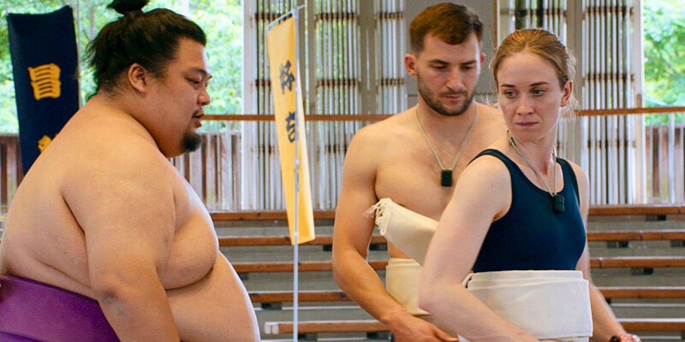 Alyssa and Josiah with a Sumo wrestler during the Detour on 'The Amazing Race' Season 37.