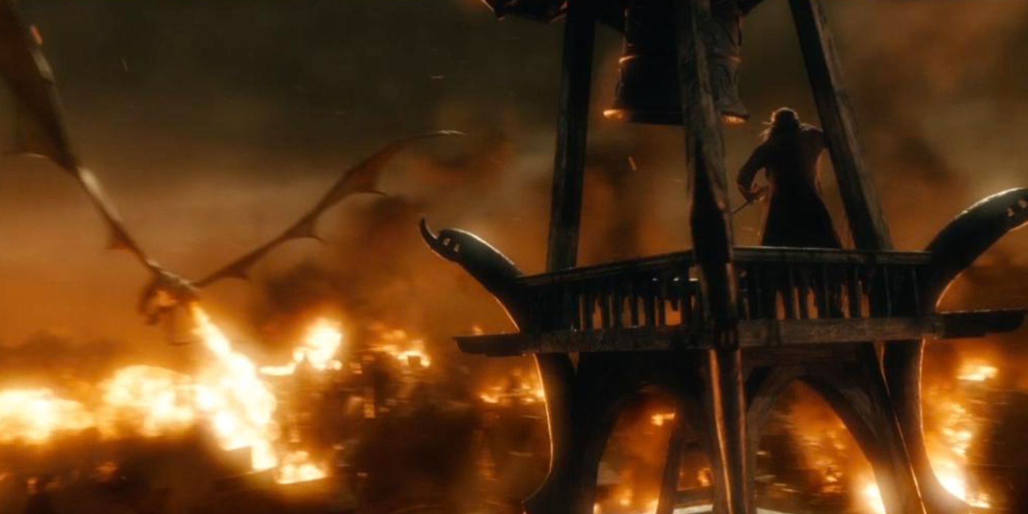 Bard (Luke Evans) on a tower watching Smaug (Benedict Cumberbatch) in The Hobbit: The Battle of the Five Armies