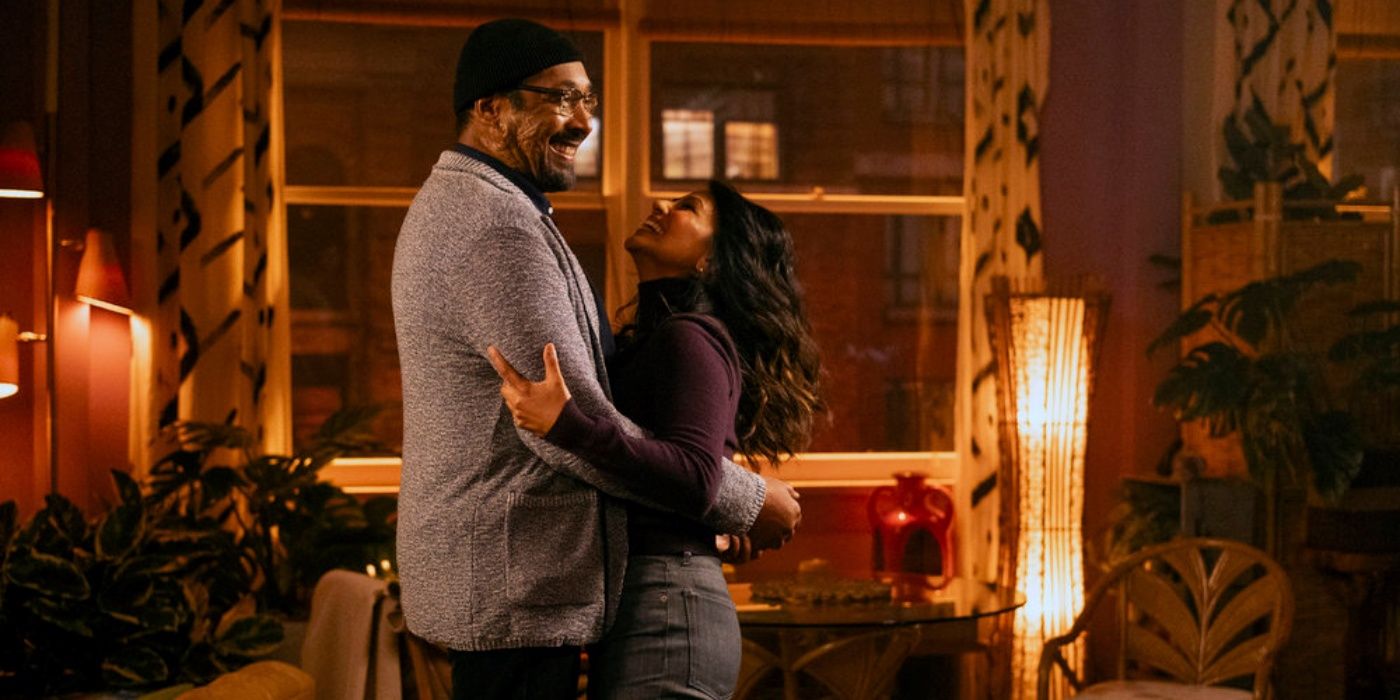 Jesse L. Martin as Alec and Karen David as Rose embracing while she looks up at him in The Irrational Season 2