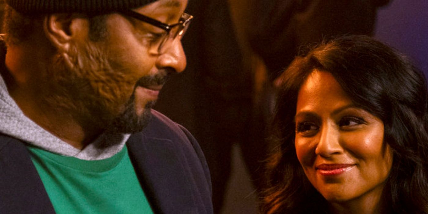 Jesse L. Martin as Alec with Karen David as Rose smiling up at him in Season 2 of The Irrational